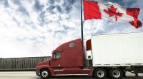 Getty image of a truck flying the Canadian flag