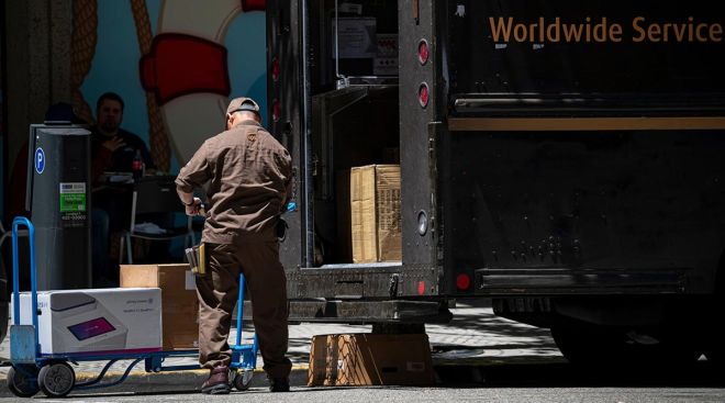 UPS driver unloading packages