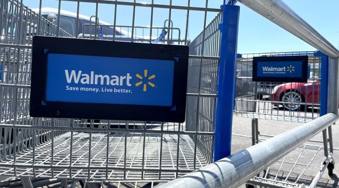 Shopping carts in the parking lot of a Walmart store